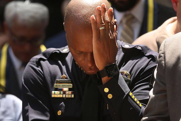 Dallas Police Chief David Brown pauses at a prayer vigil <br>